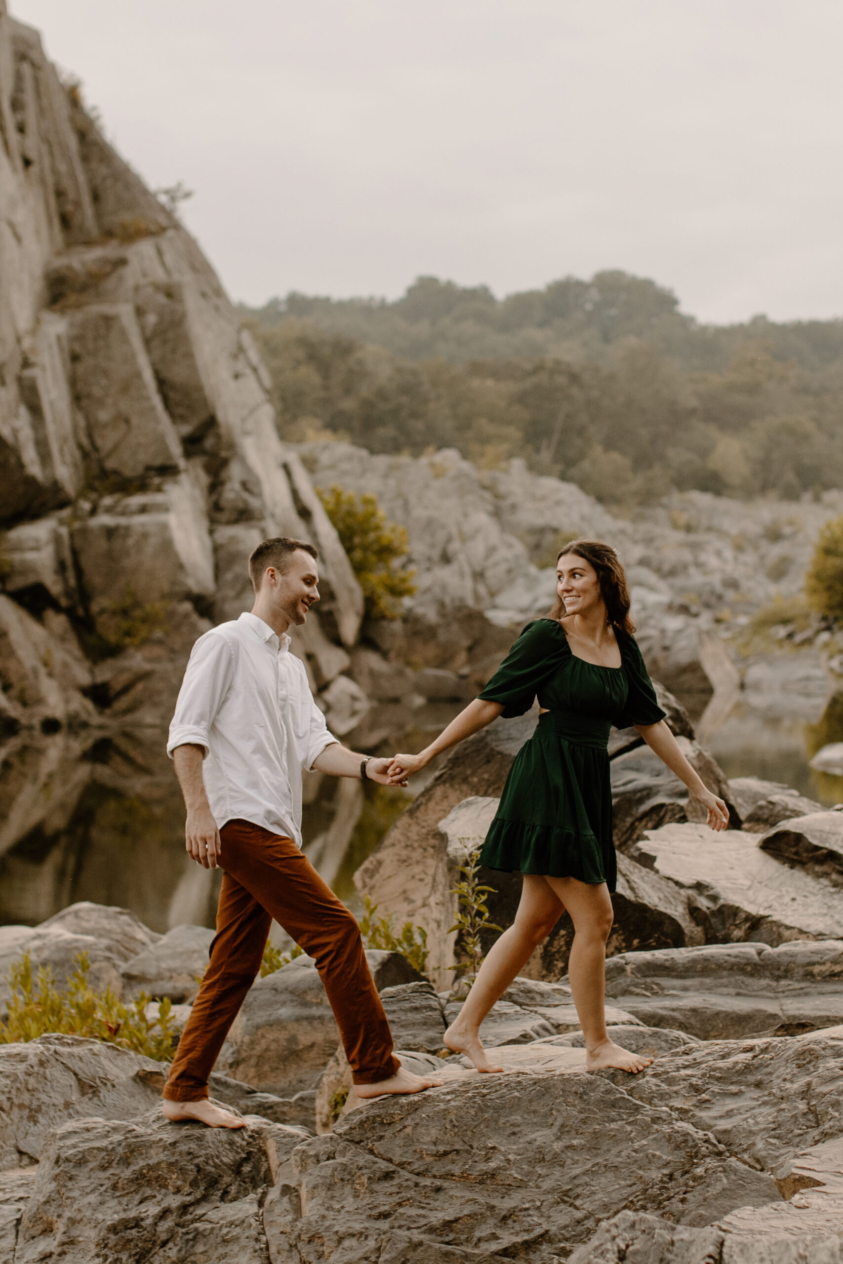 Engaged couple exploring Great Falls Maryland